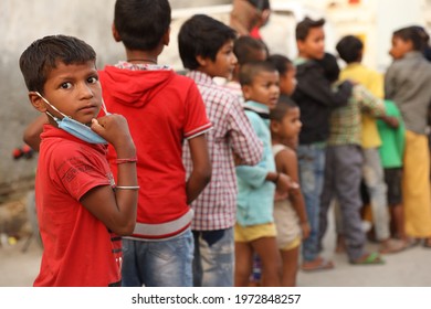 Delhi, India - May 16 2020: Poor Indian Children Getting Help From Delhi Based Charity Organisation During Corona Pandemic