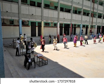 Delhi, Delhi / India - May, 21, 2020 : Food Being Distributed To Poor And Needy Section Of Society At MCD Government School During Covid19 Lock Down Maintaining Social Distancing.