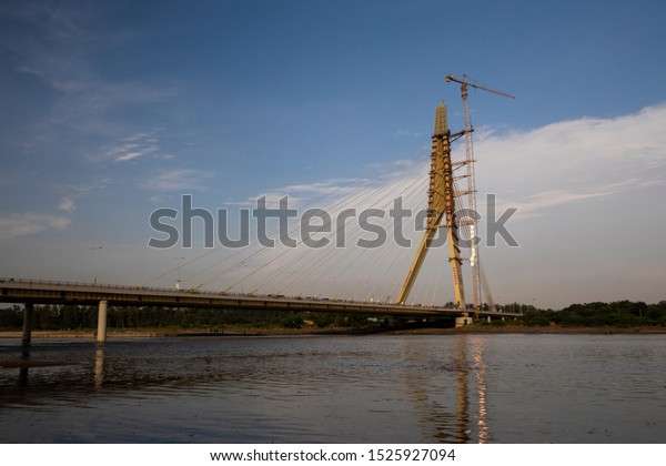 DELHI,\
INDIA, SEPTEMBER 01, 2019: View of the Signature bridge being\
constructed across the Yamuna river in New\
Delhi