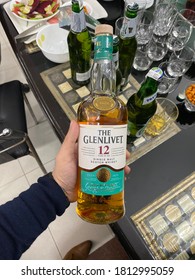 Delhi, Delhi/ India- September 2020: Man holding a Glenlivet scotch bottle in a alcohol house party.