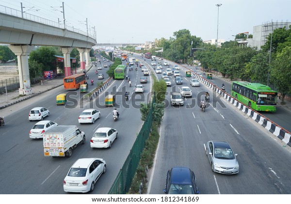 Delhi, india -\
September 9, 2020: traffic running on two lane road in new delhi,\
india                      \
