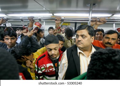 DELHI - JANUARY 19: Men Standing In A Crowded Train Carriage  On January 19, 2008 In Delhi, India. Nearly 1 Million Passengers Use The Metro Daily.