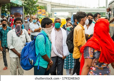 Delhi Uttar Pradesh Border, Delhi/India - Aug 8 2020: Migrants With Mask Carrying Luggage With Their Families Are Coming Back To City Search Of Work , Migrant From Bihar And Uttar Pradesh .