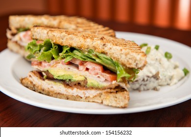 A Deli Classic Turkey Bacon Lettuce And Tomato Sandwich With Avocado On Whole Wheat Bread. 