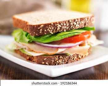 Deli Meat Sandwich With Turkey, Tomato, Onion, And Lettuce