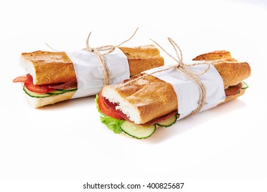 Deli Sandwiches In Paper Wrap  Isolated On White