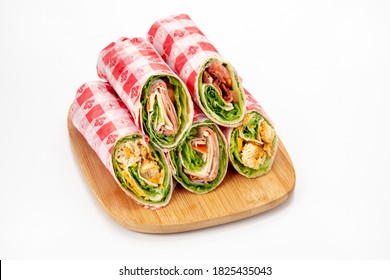 Deli Wraps With Checkered Paper On Wood Tray, Isolated On White Background.