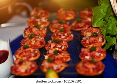 Delicacies And Snacks Mini Pizza In The Buffet.Catering. Dinner Buffet.