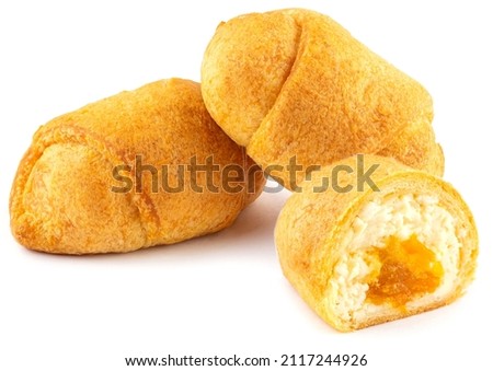 Delicate airy rolls based on yeast dough stuffed with cottage cheese and jam with peach pieces, sprinkled with powdered sugar, isolated on a white background