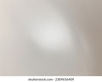 Delicate background of gray color with a light spot