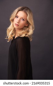 A delicate beauty. A gorgeous blonde model posing in studio. - Shutterstock ID 2169035315