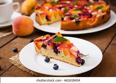 Delicate Biscuit Pie With Peaches And Blueberries. 