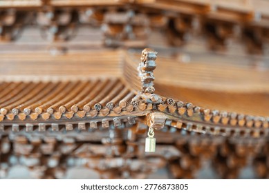Delicate close up shot of upturned eaves on Chinese ancient architectural model