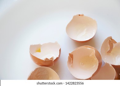 Delicate Egg Shells On A White And Airy Background.
Baking Or Cooking Background. Walking On Eggshells Background. Broken And Shattered Background.