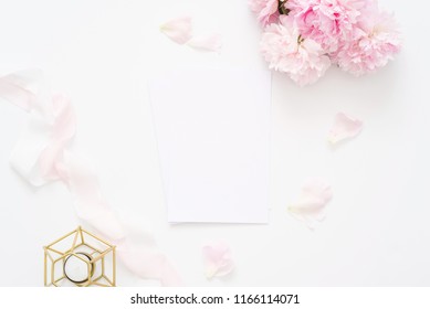 Delicate Feminine Wedding Or Birthday Flat Lay Composition With Peonies Floral Bouquet And Candle. Blank Paper Card, Mockup, Invitations. Flatlay, Top View.