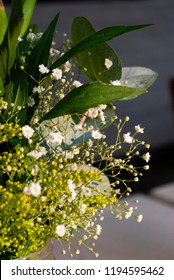 Delicate Floral Arrangement On Table In Restaurant For First Baptism Or First Communion In Central America. Guatemala.