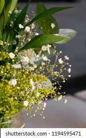 Delicate Floral Arrangement On Table In Restaurant For First Baptism Or First Communion In Central America. Guatemala.