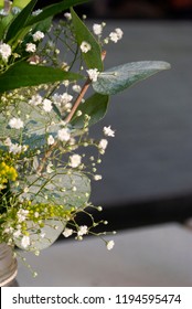 Delicate Floral Arrangement On Table In Restaurant For First Baptism Or First Communion In Central America. Guatemala.