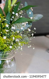 Delicate Floral Arrangement On Table In Restaurant For First Baptism Or First Communion In Central America. Guatemala.