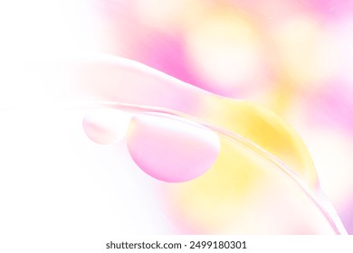 Delicate pastel-colored liquid bubbles on glass, featuring soft pink, yellow, and white hues. Macro photo