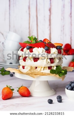 Delicate Pavlova cake with berries
