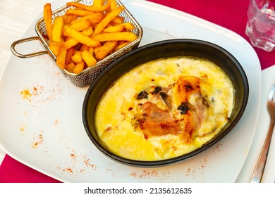 Delicate Savoyard chicken escalope baked with bacon and zucchini in creamy sauce with dry white wine and emmental cheese, served with crispy fries..