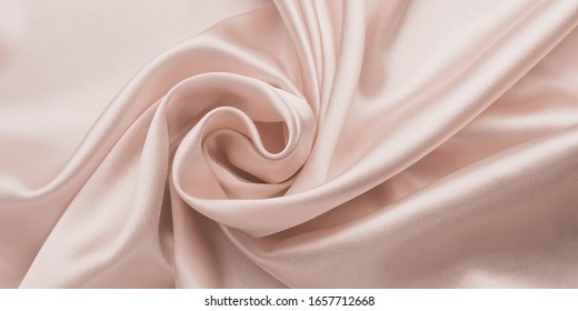 Delicate Smooth Soft Pink Silk Bedsheet, Abstract Fabric Background With Waves. Beige Shiny Textile Texture. Satin Folds, Luxury Fashion. Glossy Clothes.