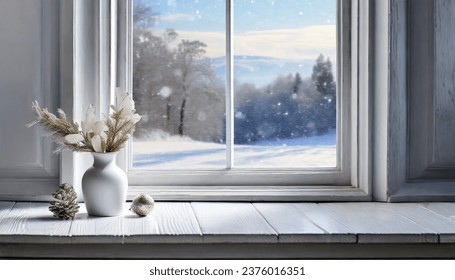 A delicate vase adorns a tall white window, resting on a white wooden table. A framed picture of a snowy landscape serves as the background - Shutterstock ID 2376016351