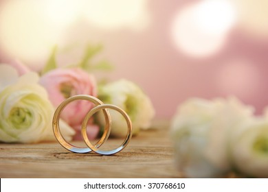 Delicate Wedding background with Rings and Buttercup Flower