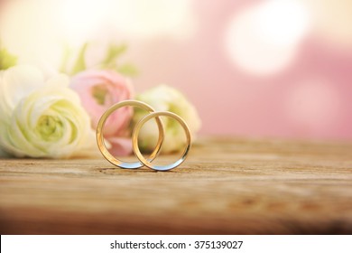 Delicate Wedding background with Rings and Buttercup Flower