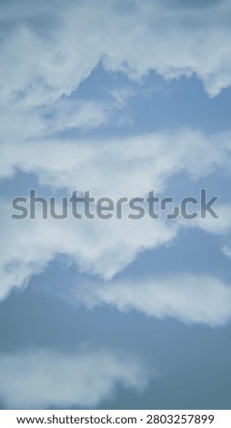 Delicate wispy and puffy white clouds scattered over soft light blue sky, beautiful natural cloudscape with soft edges and gentle shapes. Calm and airy mood, bright daylight, subtle depth, peaceful atmospheric background, perfect for nature and weather themes.
