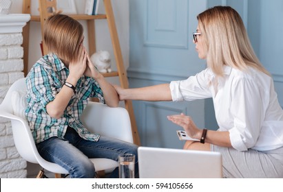 Delicate woman calming down a teenager