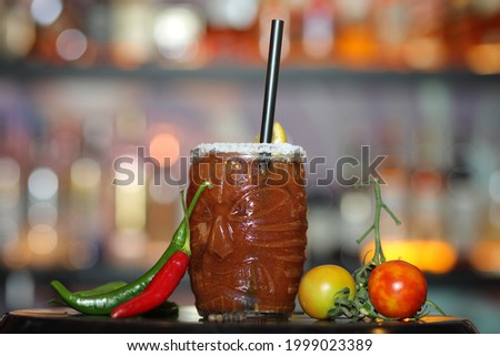 Delicious alcoholic drink Blurred background on table in a bar with pepper and tomatoes