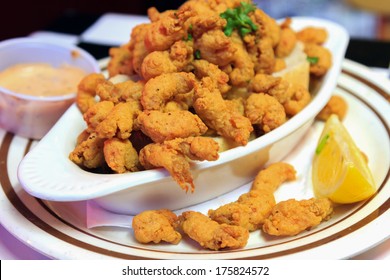 A Delicious Appetizer Plate Of New Orleans Style Crawfish With Dipping Sauce And Lemon