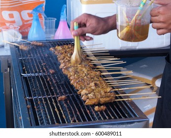 Delicious Asian Cuisine, Malaysia Chicken Satay Cooking on a Hot Charcoal Grill