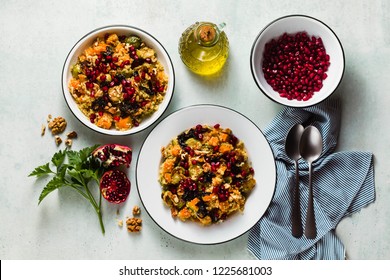 Delicious autumn festive salad of pumpkin, brussels sprouts, quinoa, walnuts, caramelized onions and pomegranate seeds. Healthy Vegan Gourmet Recipe