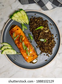 Delicious Baked Honey-soy Glazed Salmon Fillet Served With Black Beluga Lentils With Cucumber And Green Onions. Healthy Fresh Salmon Steak For Lunch Or Dinner. Top View