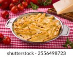 Delicious Baked Penne Pasta Dish With Cherry Tomatoes and Cheese