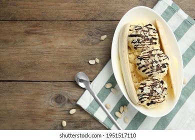 Delicious Banana Split Ice Cream On Wooden Table, Flat Lay. Space For Text