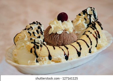 Delicious Banana Split On White Plate