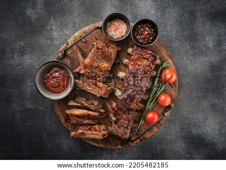 Delicious barbecued ribs seasoned with a spicy basting sauce. Smoked American style pork ribs.