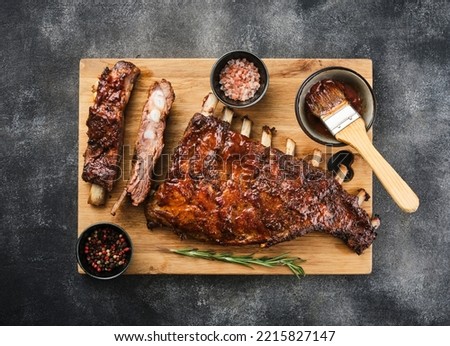 Delicious barbecued ribs seasoned with a spicy basting sauce. Smoked American style pork ribs. Top view.