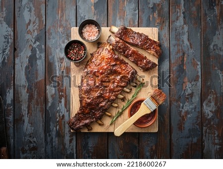 Delicious barbecued ribs seasoned with a spicy basting sauce. Smoked American style pork ribs.