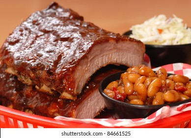 Delicious BBQ Ribs With Beans, Cole Slaw And A Tangy BBQ Sauce