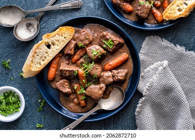 Delicious Beef Bourguignon Stew With Wine, Carrots And Onion Garnished With Parsley.