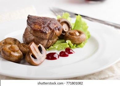 Delicious Beef Filet Mignon Served On White Plate With Roasted Mushrooms