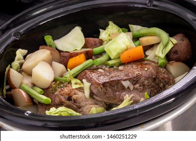 Delicious Beef Stew Cooking In The Crockpot With Vegetables Closeup