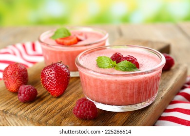 Delicious berry mousse in bowls on table close-up - Powered by Shutterstock