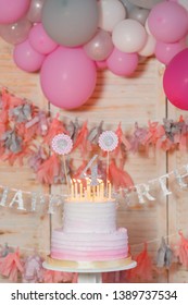 Delicious birthday cream cake with candles on the background with balloons. Beautiful cake with pink decoration for girl. Girl's birthday. - Shutterstock ID 1389737534
