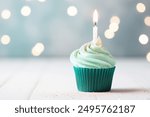 Delicious birthday cupcake with burning candle and space for text on blurred lights background